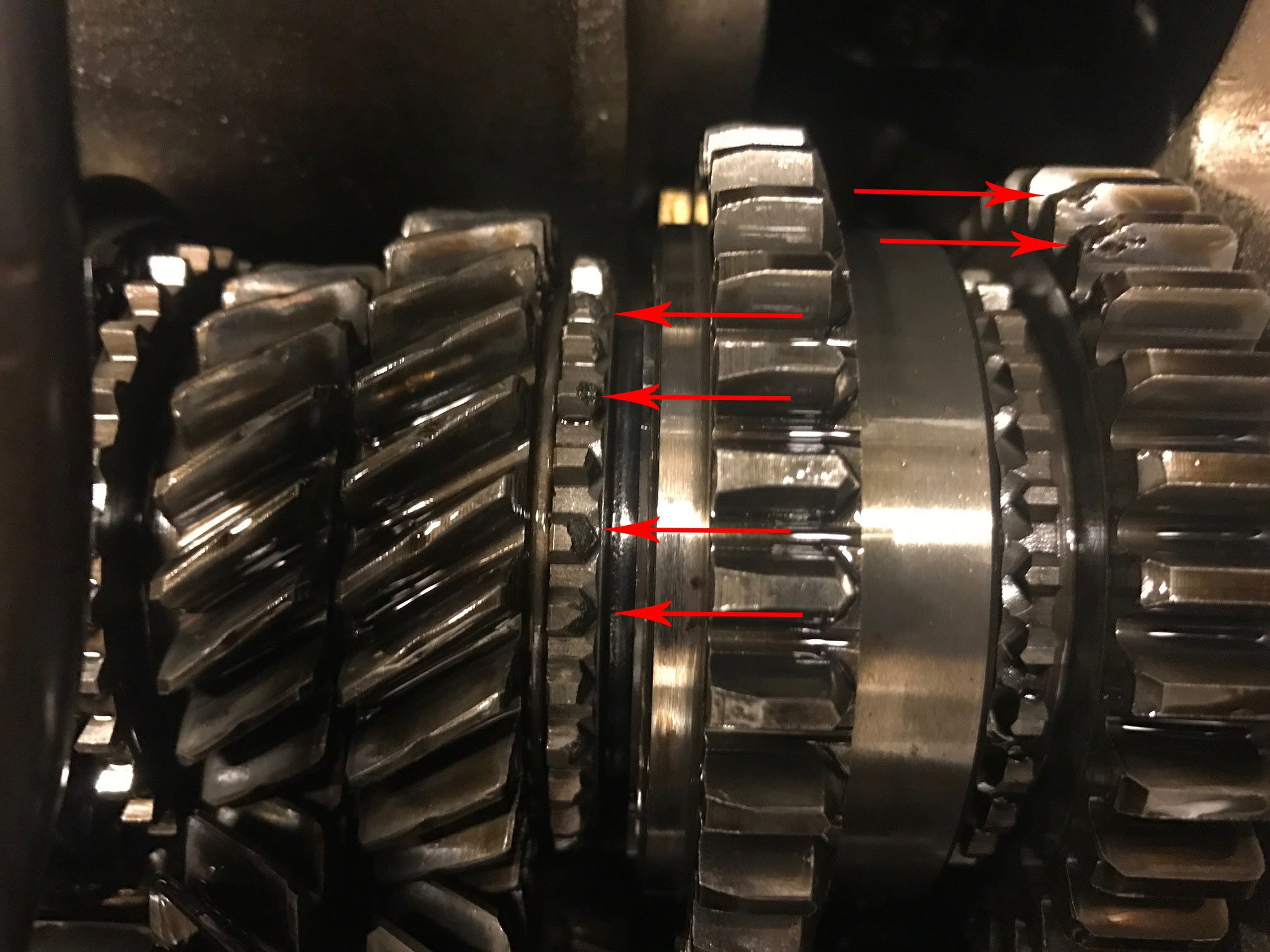a split image showing a healthy transmission (smooth gears) vs. a damaged one (worn components).