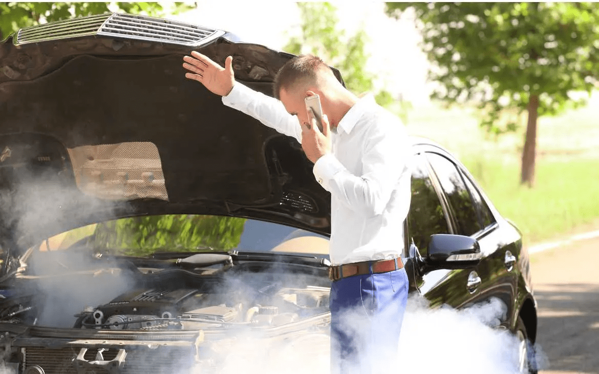 car hood emitting smoke with a temperature gauge in the red car hood emitting smoke with a temperature gauge in the red