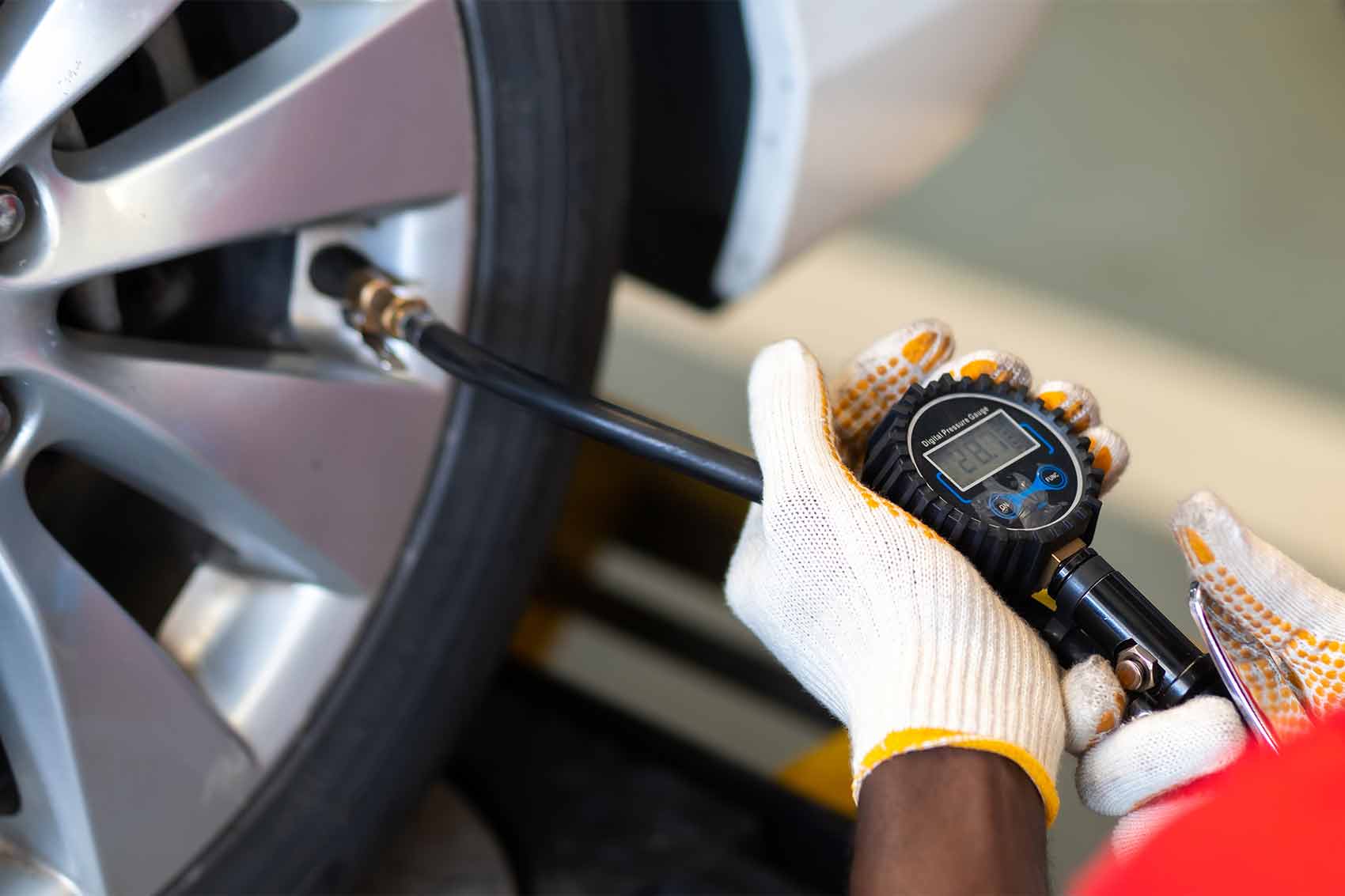 checking pressure at a gas station.