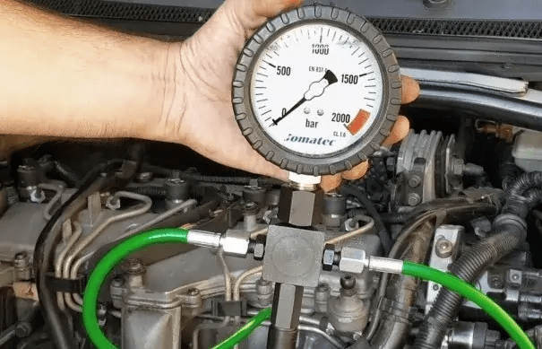 fuel pressure gauge attached to a fuel rail.
