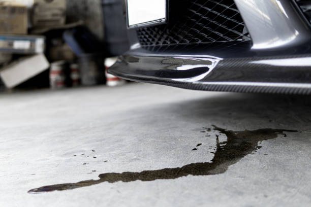 photo of an oil puddle under a car