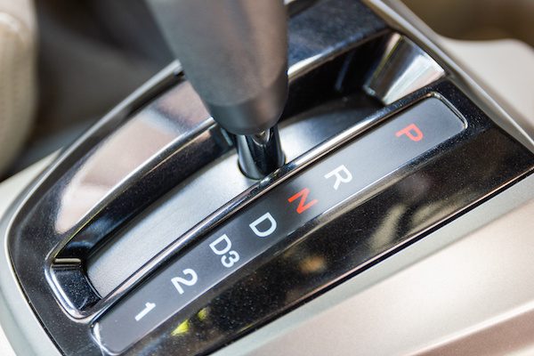 closeup gear n: "neutral", which disengages the transmission and rear wheels, permitting the car to roll freely