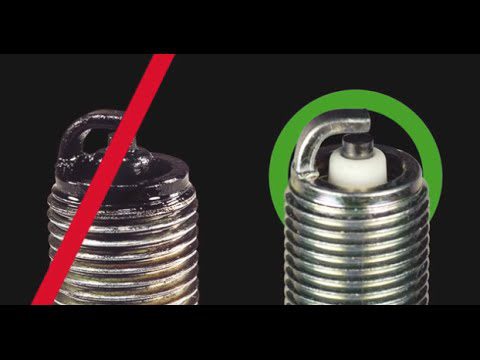 side by side photos healthy vs. fouled spark plugs.