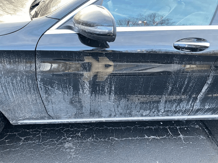 split image of a salt covered car vs. a cleaned one